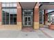 Exterior view of a building entrance, featuring a modern glass door and a brick facade with inviting pathway at 1499 Blake St # 3O, Denver, CO 80202