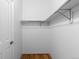 A walk-in closet has wood floors and a closet rod at 1499 Blake St # 3O, Denver, CO 80202