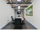 Modern conference room with a large table, comfortable seating, and a wall-mounted TV for presentations at 1499 Blake St # 3O, Denver, CO 80202