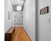 Hallway features exposed pipes, a bench, and wooden floors at 1499 Blake St # 3O, Denver, CO 80202