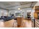Modern kitchen and living space with hardwood floors, exposed ceilings, and natural light at 1499 Blake St # 3O, Denver, CO 80202
