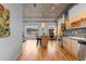 Bright and open living space with kitchen views, hardwood floors and modern lighting fixtures at 1499 Blake St # 3O, Denver, CO 80202
