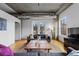Cozy living room showcasing a balcony view, comfortable seating, and hardwood flooring at 1499 Blake St # 3O, Denver, CO 80202
