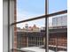 Exterior view of buildings seen through a window at 1499 Blake St # 3O, Denver, CO 80202