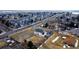 Aerial view of the residence with surrounding neighborhood and tree-lined streets at 7208 Secrest Ct, Arvada, CO 80007