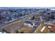 Aerial view of the neighborhood, showcasing the property's backyard and location near roadways at 7208 Secrest Ct, Arvada, CO 80007