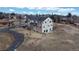 Beautiful aerial view of the multi-story home with mature landscaping and winding driveway at 7208 Secrest Ct, Arvada, CO 80007