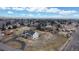 Aerial shot of the property reveals its large lot in a suburban neighborhood at 7208 Secrest Ct, Arvada, CO 80007