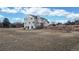 Large backyard with ample space for recreation and a retaining wall at 7208 Secrest Ct, Arvada, CO 80007