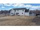 Expansive backyard with patio and outdoor seating, perfect for entertaining at 7208 Secrest Ct, Arvada, CO 80007