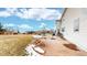 Spacious backyard featuring a patio and ample space for outdoor activities at 7208 Secrest Ct, Arvada, CO 80007