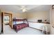 Bedroom featuring a bunk bed, built-in desk, neutral colors, and natural lighting at 7208 Secrest Ct, Arvada, CO 80007