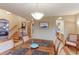 Open floorplan showcasing dining room with decorative table and archway to kitchen at 7208 Secrest Ct, Arvada, CO 80007