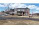 Charming two-story home with brick turret and welcoming front porch on a large lot at 7208 Secrest Ct, Arvada, CO 80007