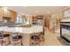 Open kitchen with a large island, quartz countertops, stainless steel appliances, and barstool seating at 7208 Secrest Ct, Arvada, CO 80007