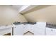 Convenient laundry room features washer, dryer, and sink with plenty of cabinet space at 7208 Secrest Ct, Arvada, CO 80007