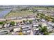 Aerial view of a manufactured home community near a lake and open fields, showcasing location and surroundings at 8426 Cook Way, Denver, CO 80229