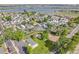 Aerial view featuring a peaceful community with mature trees and recreational area close to the lake at 8426 Cook Way, Denver, CO 80229