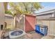 View of backyard with shed, AC unit, and trash bins next to a beige-colored fence at 8426 Cook Way, Denver, CO 80229