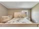Comfortable bedroom with large bed, overhead light, and neutral-toned walls at 8426 Cook Way, Denver, CO 80229