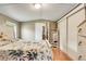 Cozy bedroom with a queen bed, closet, and hardwood flooring at 8426 Cook Way, Denver, CO 80229