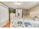 Comfortable bedroom with a large bed, TV, closet and hardwood flooring at 8426 Cook Way, Denver, CO 80229