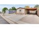 Tan home featuring stone accents, and a covered carport in a lovely neighborhood at 8426 Cook Way, Denver, CO 80229