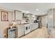 Bright kitchen with modern cabinets, stainless appliances, stylish countertops, and wood flooring at 8426 Cook Way, Denver, CO 80229