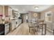 Open Kitchen and Dining Area with stainless appliances and modern finishes at 8426 Cook Way, Denver, CO 80229