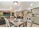 Open living space with neutral paint, modern kitchen and comfortable seating at 8426 Cook Way, Denver, CO 80229