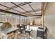 Outdoor patio space featuring a grill, dining set, a pergola and brick flooring at 8426 Cook Way, Denver, CO 80229