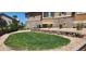 Landscaped backyard with terraced rock walls and lush green grass, perfect for outdoor activities at 6711 S Catawba Way, Aurora, CO 80016