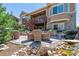 Patio with water feature, lounge furniture, and elegant outdoor lighting in a serene setting at 6711 S Catawba Way, Aurora, CO 80016