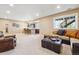 This basement features a sectional sofa, a recliner, and a wet bar at 6711 S Catawba Way, Aurora, CO 80016