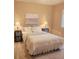 Cozy bedroom featuring soft lighting from side lamps and a calming art piece at 6711 S Catawba Way, Aurora, CO 80016