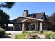 Stunning clubhouse featuring stone accents, a covered entry, and well maintained landscaping at 6711 S Catawba Way, Aurora, CO 80016