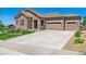 Charming home with stone accents, a three-car garage, and a well-maintained front yard at 6711 S Catawba Way, Aurora, CO 80016
