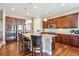 Spacious kitchen with a large island, stainless steel appliances, and granite countertops at 6711 S Catawba Way, Aurora, CO 80016