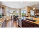 Bright kitchen with a breakfast nook, large island, and stainless steel appliances at 6711 S Catawba Way, Aurora, CO 80016