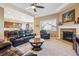 Spacious living room featuring a fireplace, a large window, and a comfortable seating area at 6711 S Catawba Way, Aurora, CO 80016