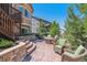 Outdoor patio with stone steps, comfortable seating and serene landscaping; perfect for relaxation at 6711 S Catawba Way, Aurora, CO 80016