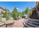Patio with fire pit, comfortable seating and a nearby hot tub; ideal for entertaining at 6711 S Catawba Way, Aurora, CO 80016
