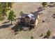 Aerial view of a stunning log home with solar panels nestled in a tranquil, natural setting at 280 Hess Ave, Golden, CO 80401