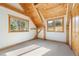 Bright bedroom features vaulted ceilings with wood beams, natural light, and carpeted floor at 280 Hess Ave, Golden, CO 80401