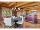 Open-concept dining room with modern lighting and wood accents open to the kitchen space at 280 Hess Ave, Golden, CO 80401