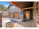 Inviting exterior showcasing a wooden porch, stone accents, and a two-car garage at 280 Hess Ave, Golden, CO 80401