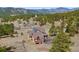 Sprawling wooded property with a luxurious log home and solar panels at 280 Hess Ave, Golden, CO 80401
