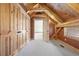 Hallway with wood beam ceiling, closet, and doorway to another room at 280 Hess Ave, Golden, CO 80401