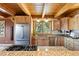 Kitchen featuring wooden cabinets, stainless steel appliances, granite countertops and a scenic view at 280 Hess Ave, Golden, CO 80401
