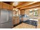Modern kitchen with stainless steel appliances, wood cabinets and countertops, and plenty of natural light at 280 Hess Ave, Golden, CO 80401